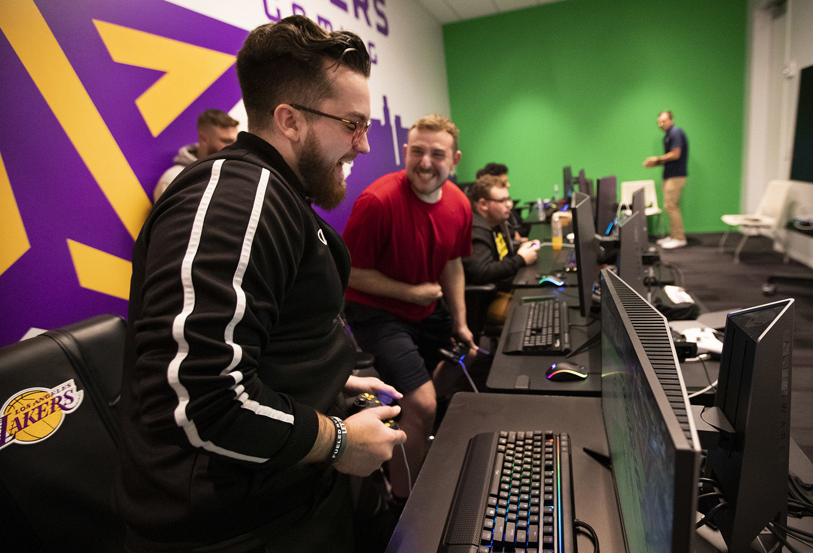 "Mooty" Mitchell Franklin, 25, left, and "Detoxys" Christopher Doyle, 23, react during a scrimmage against the Minnesota Timberwolves 2K team, while inside the gaming room at the Lakers practice facility in El Segundo, California.
